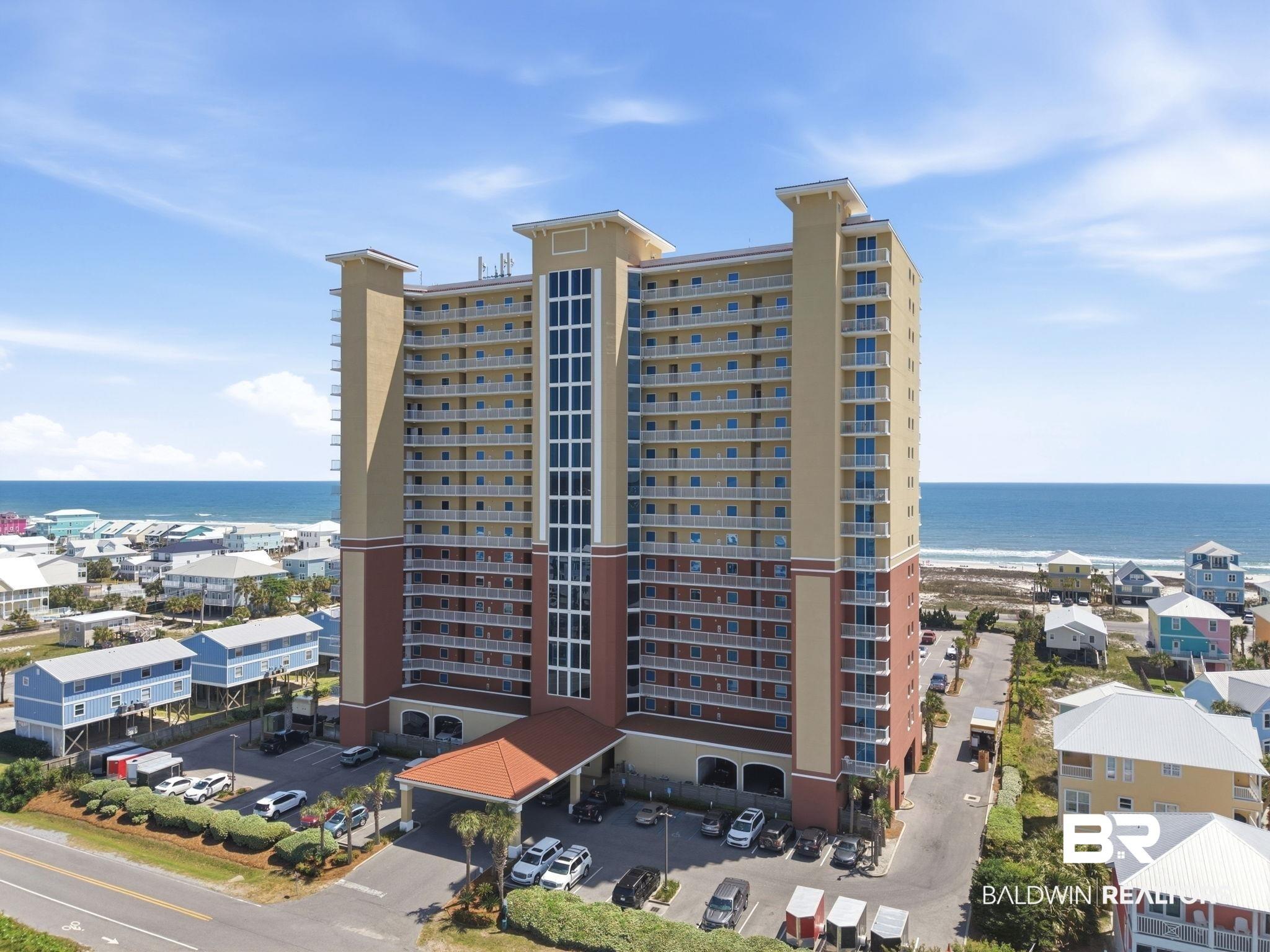Image 2: View of apartment building / complex with a water view