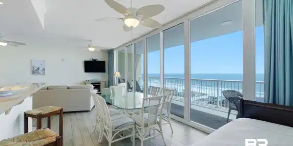 Image 3: Dining space featuring floor to ceiling windows, light wood-style flooring, and ceiling fan