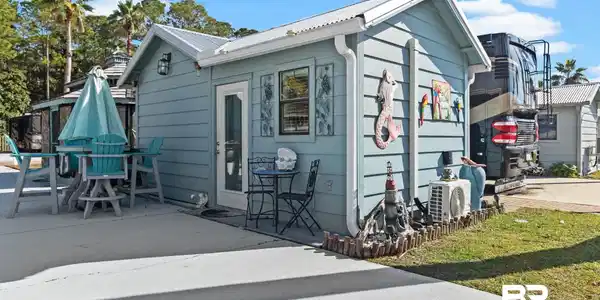 Image 2: View of front of property with a metal roof
