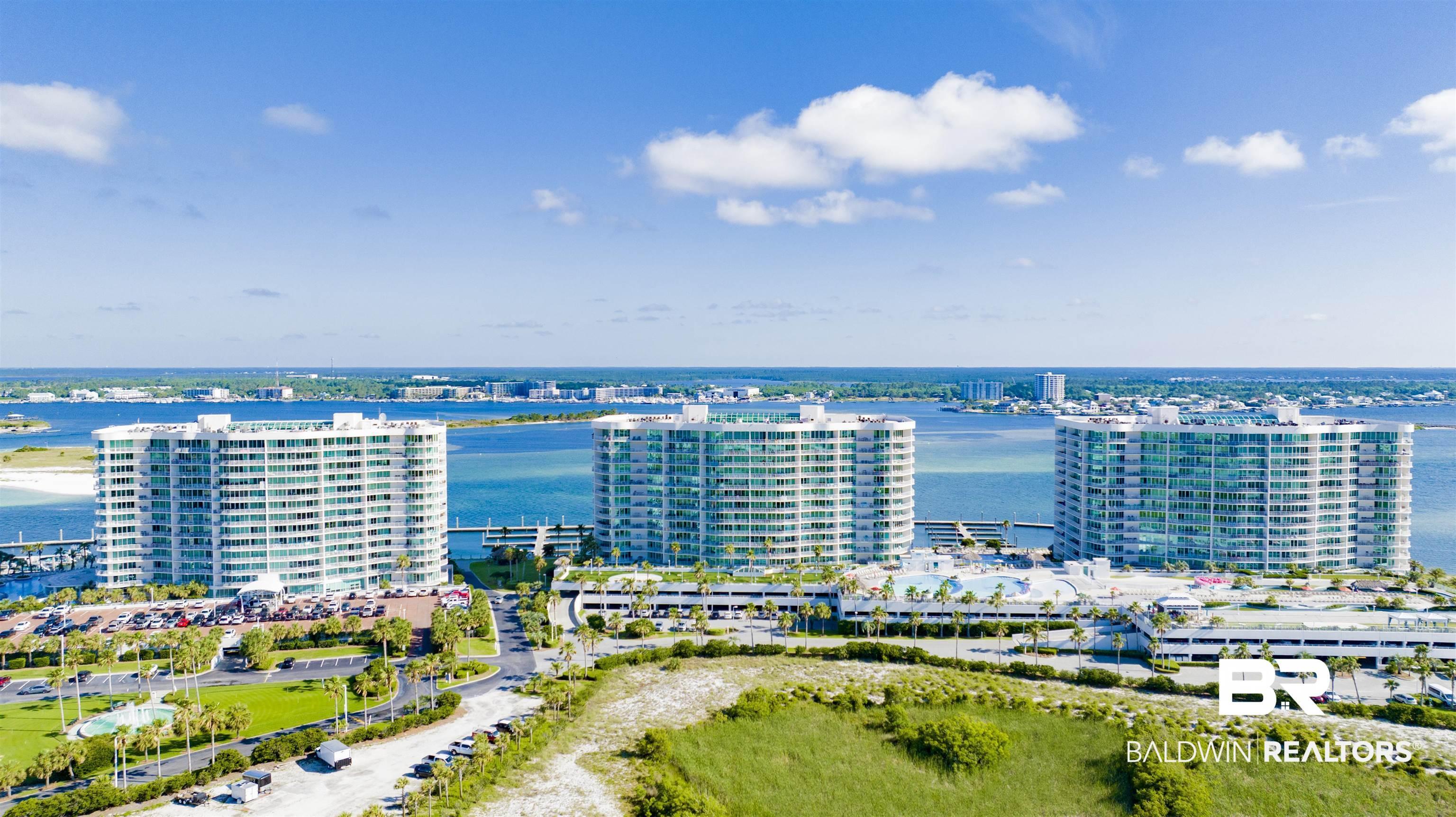 Image 2: Modern high-rise residential complex featuring multiple buildings with expansive window lines