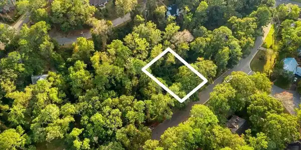 Image 4: View of property location featuring property boundaries highlighted and a heavily wooded area
