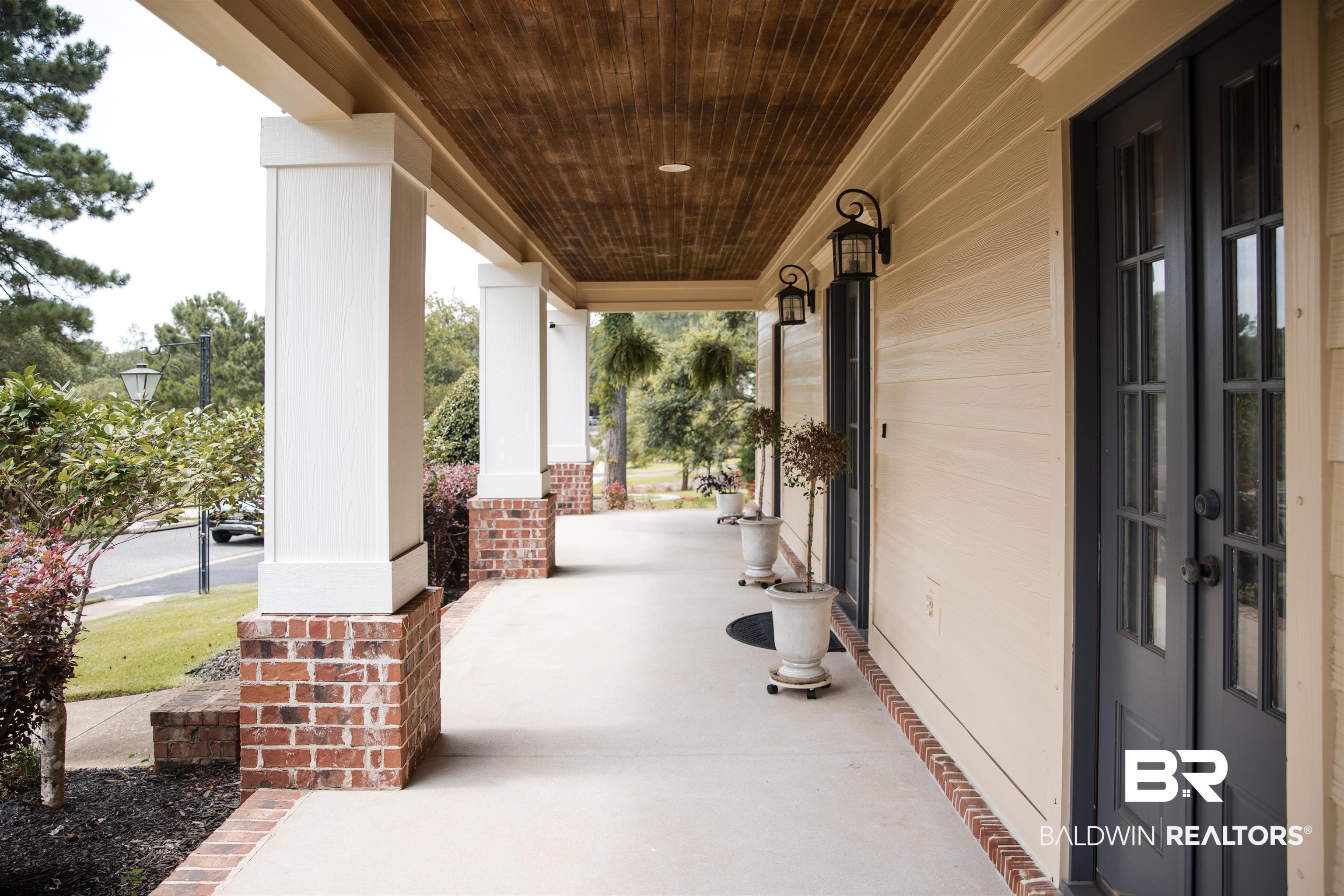 Image 4: Covered front porch featuring a wood-finish ceiling