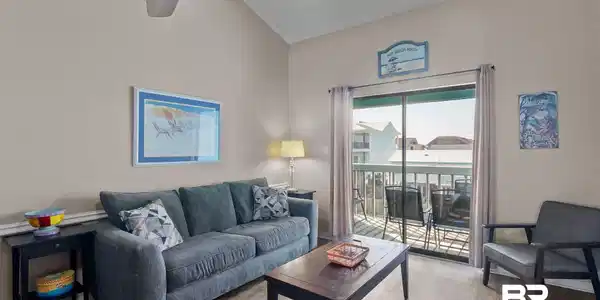 Image 3: Living room with vaulted ceiling, wood finished floors, and ceiling fan