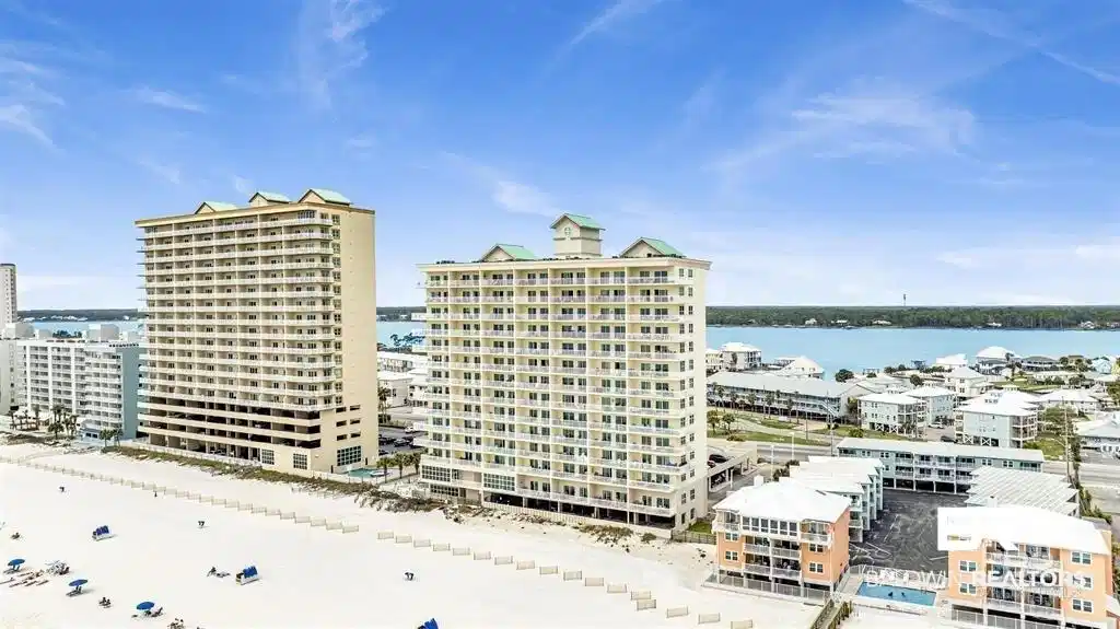 Image 1: Beachfront high-rise building featuring multiple balconies