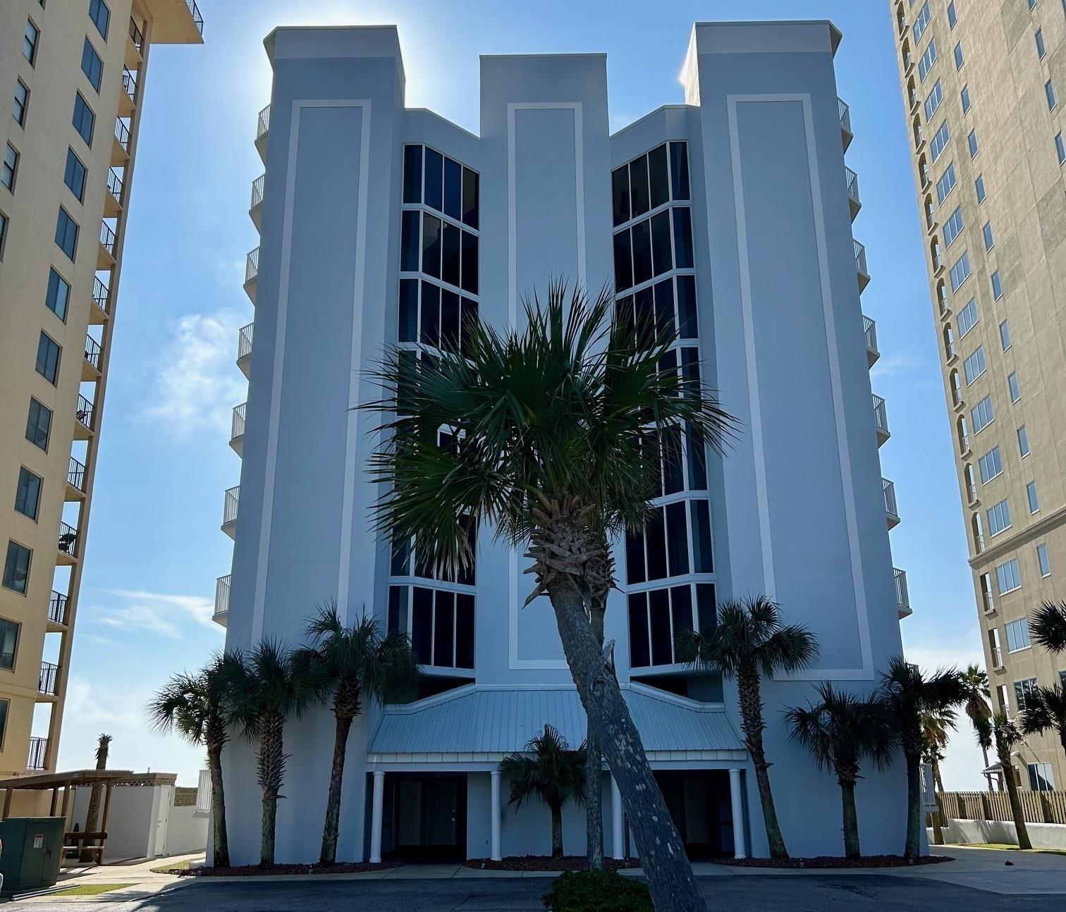 Image 1: View of apartment building / complex