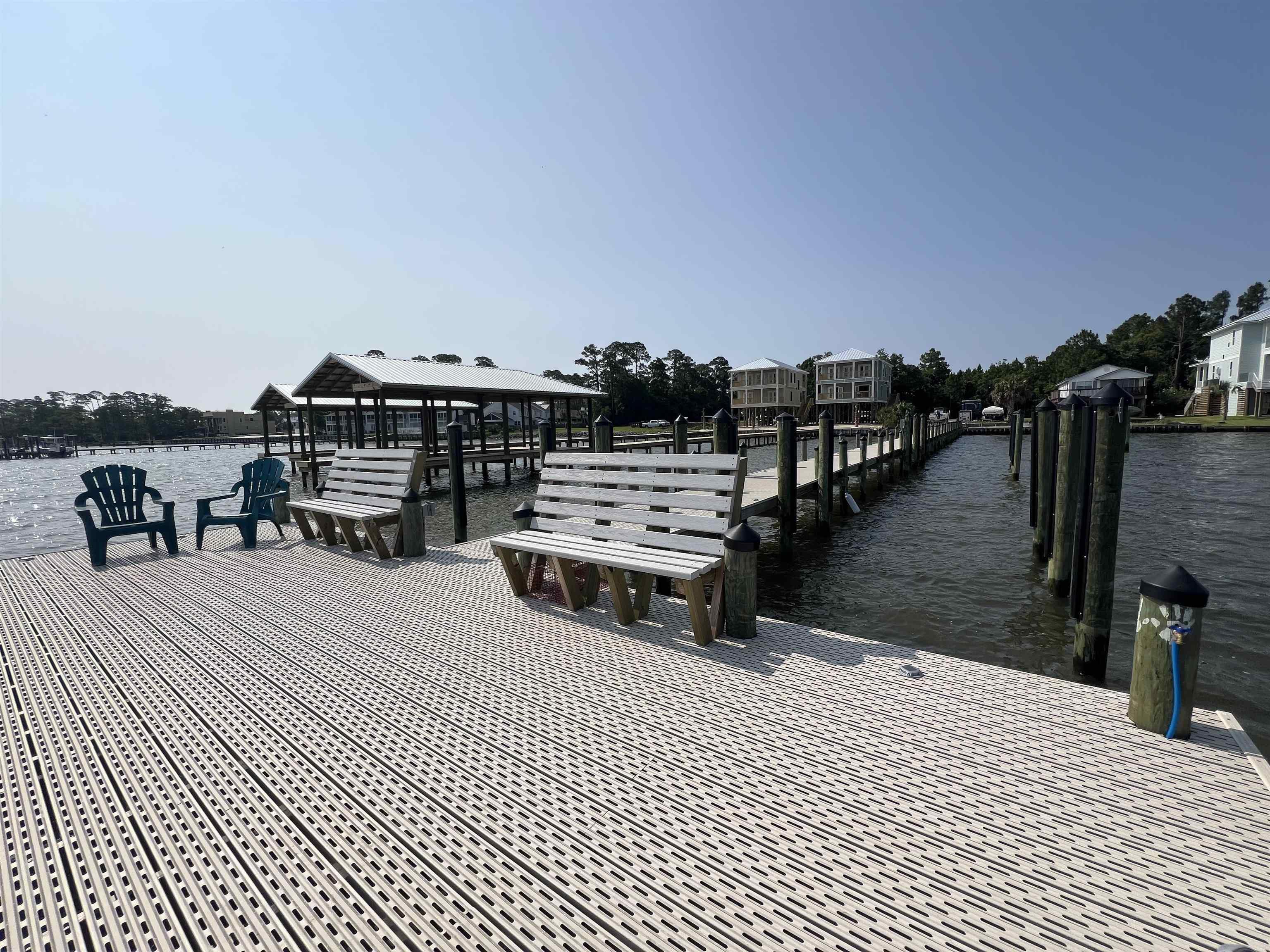 Image 2: Dock featuring a gazebo and a water view