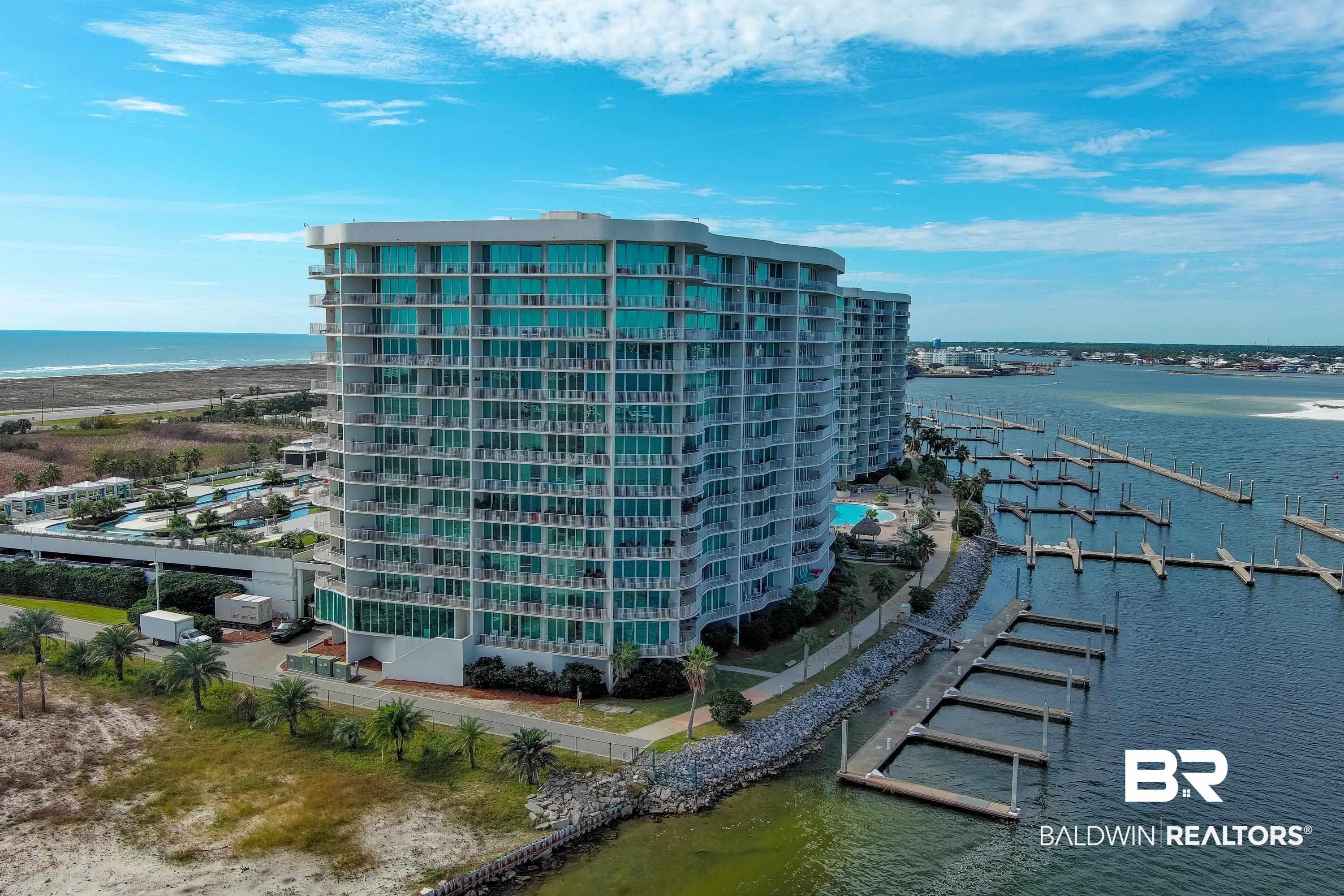 Image 2: View of apartment building / complex with a water view