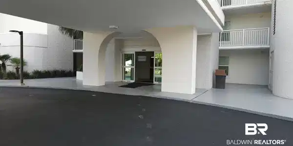 Image 2: Doorway to property featuring stucco siding