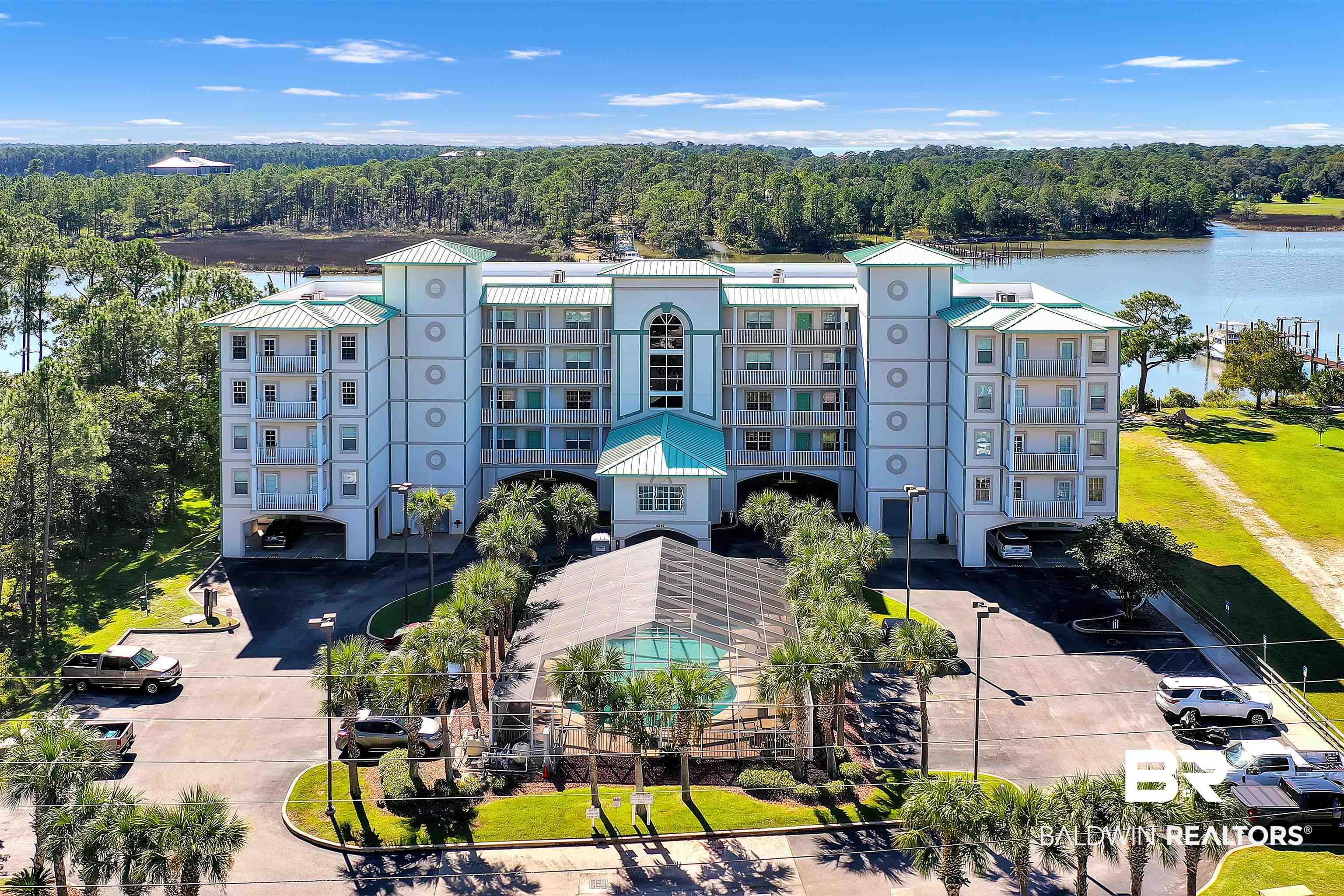 Image 1: Birds eye view of property with a water view
