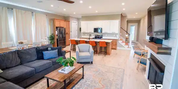 Image 3: Living area featuring light wood-style floors, recessed lighting, crown molding, ceiling fan, and stairway