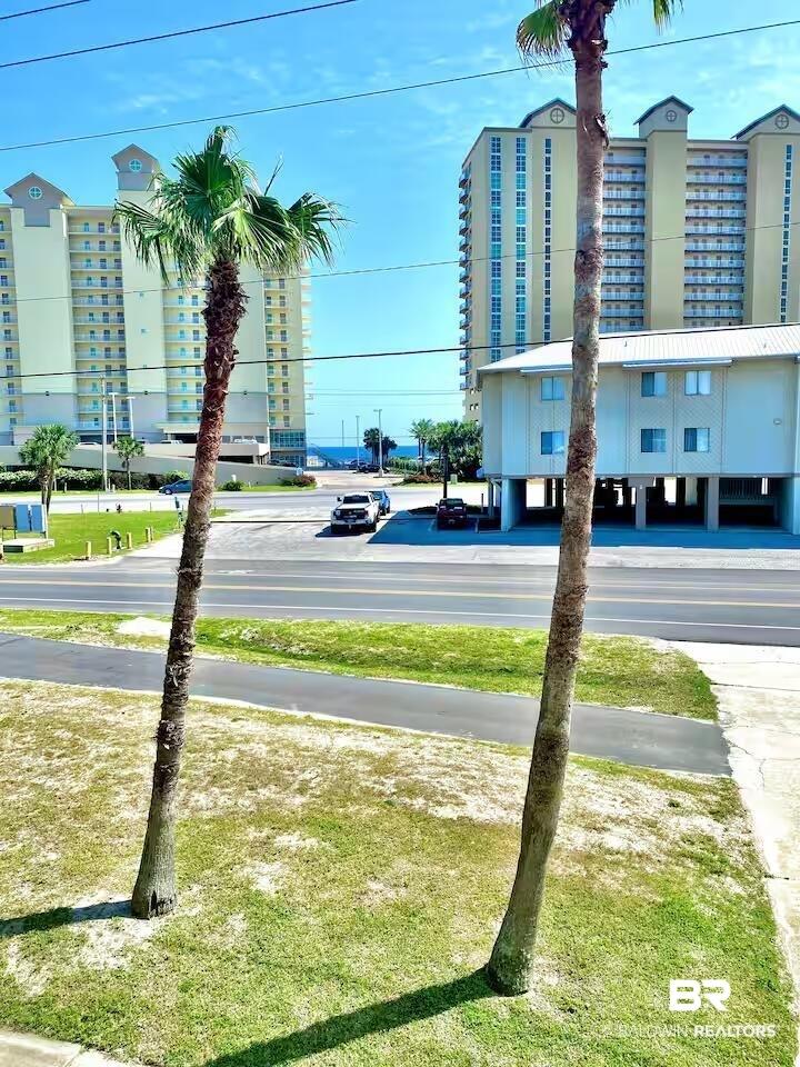 Image 2: View of asphalt road with sidewalks and curbs