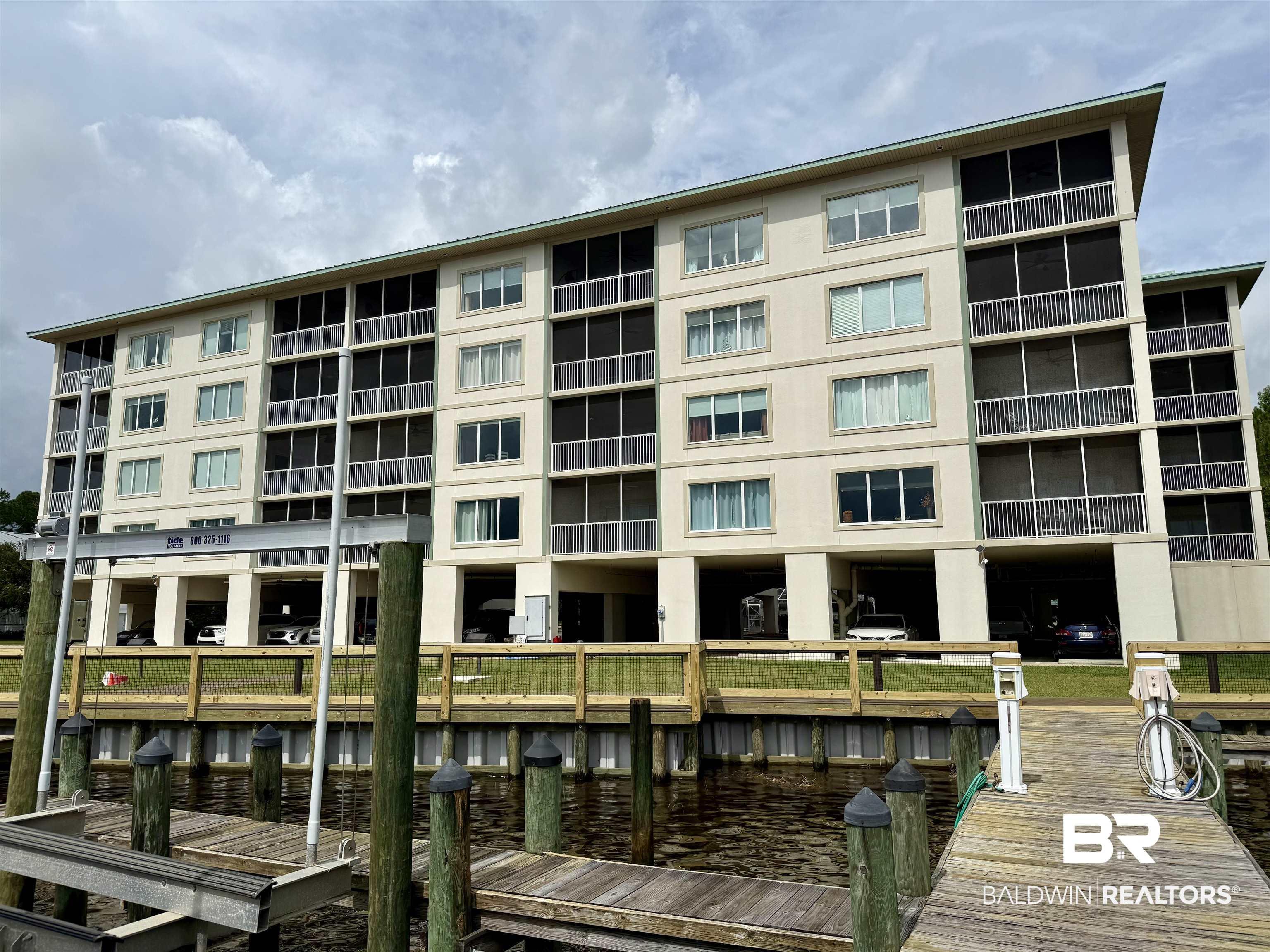 Image 3: View of apartment building / complex with a water view