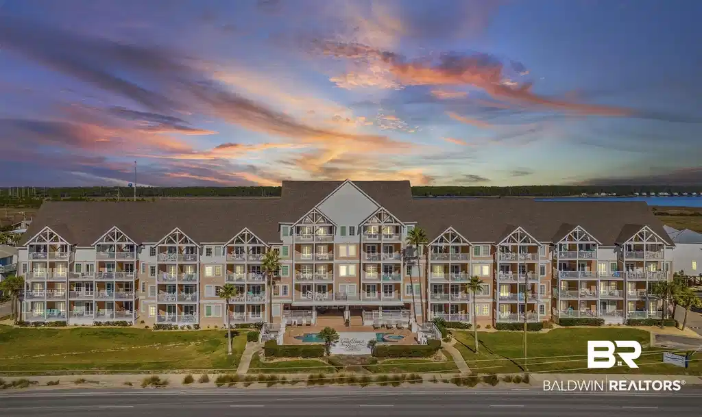 Image 1: Property at dusk with a view of apartment building / complex