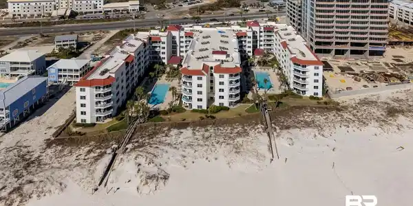 Image 2: Aerial view of apartment complex / building and a pool