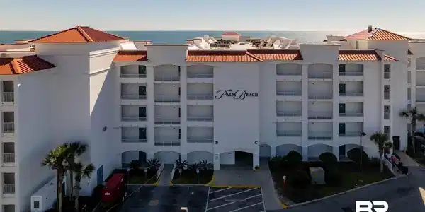 Image 3: View of property featuring a water view and uncovered parking
