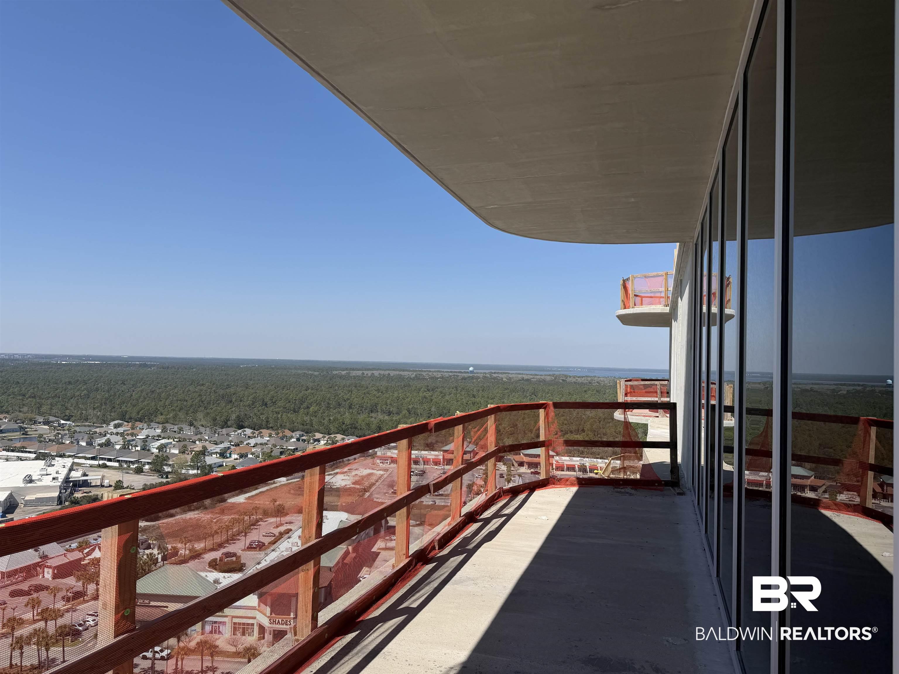 Image 4: Balcony featuring a view of trees