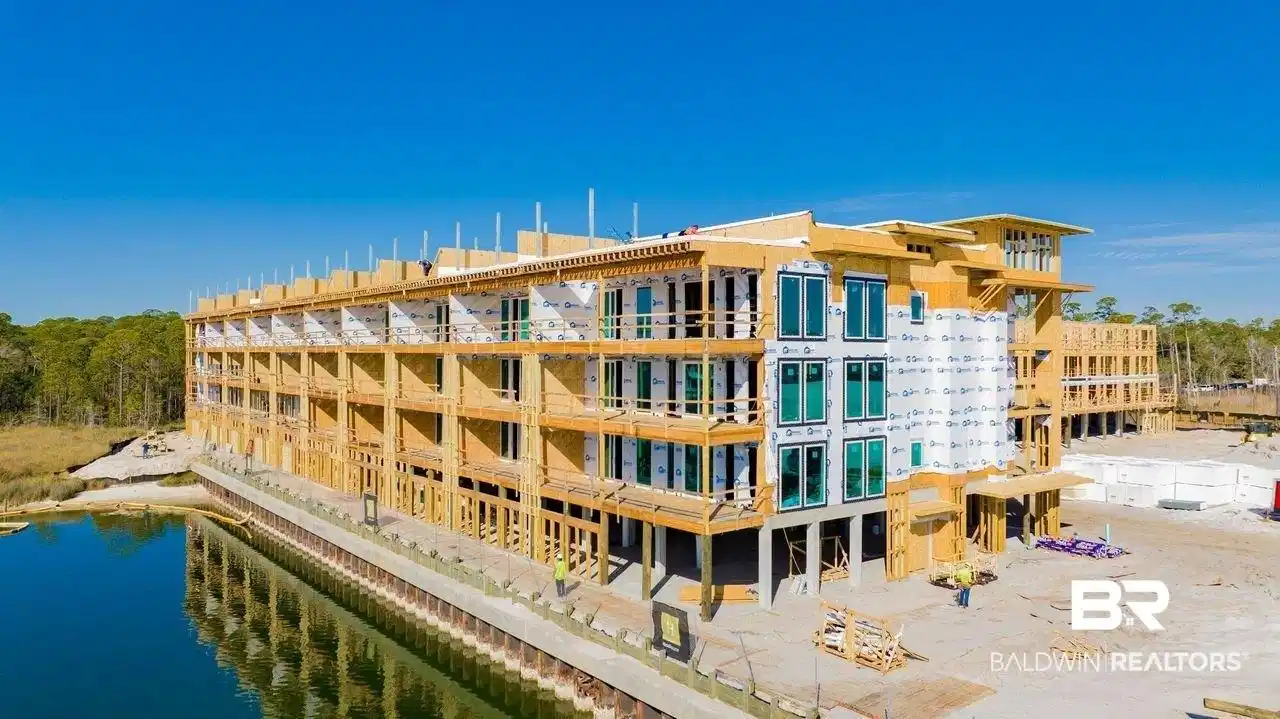 Image 1: View of apartment building / complex with a water view