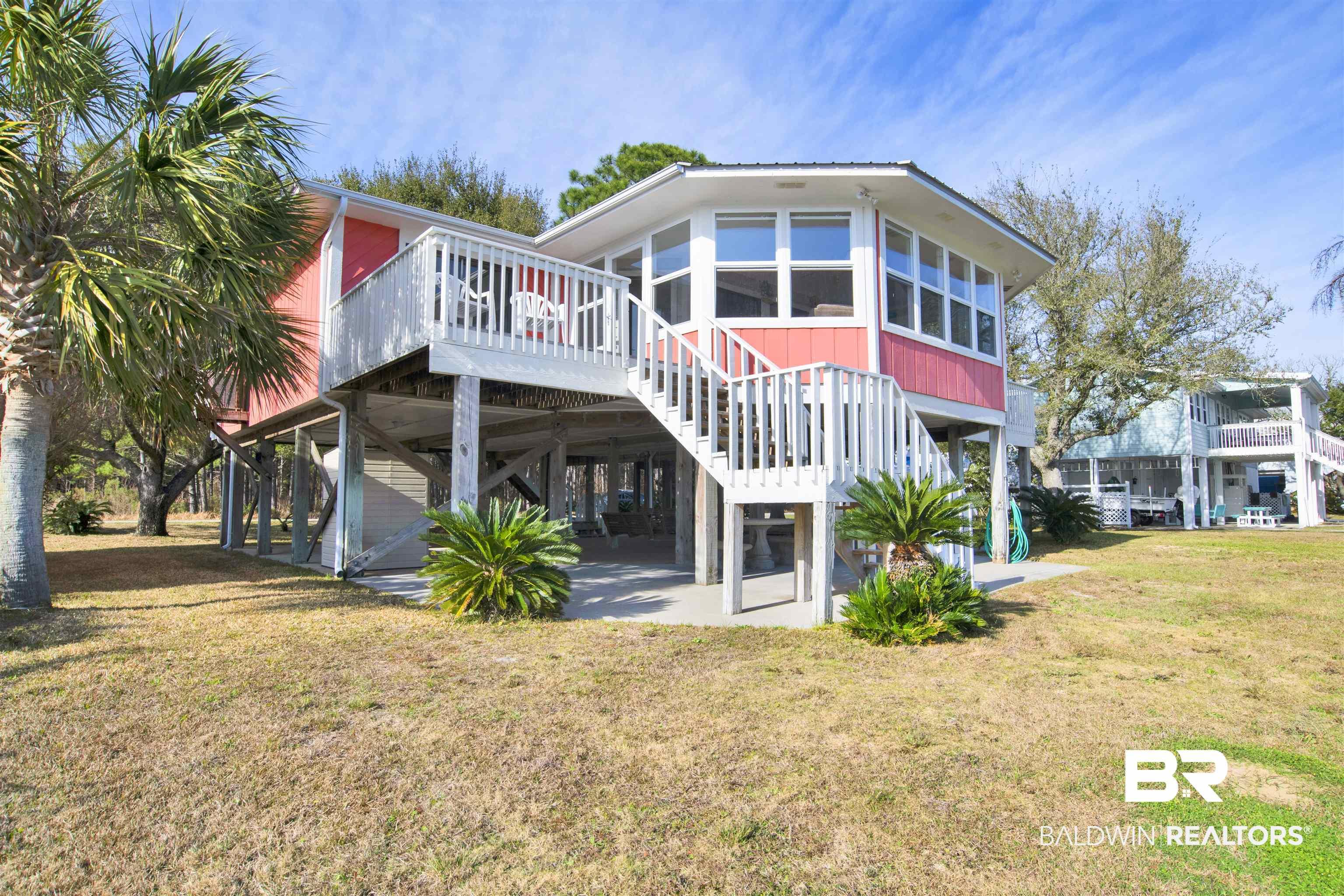 Image 3: Rear view of house with a patio, a yard, a carport, and a deck