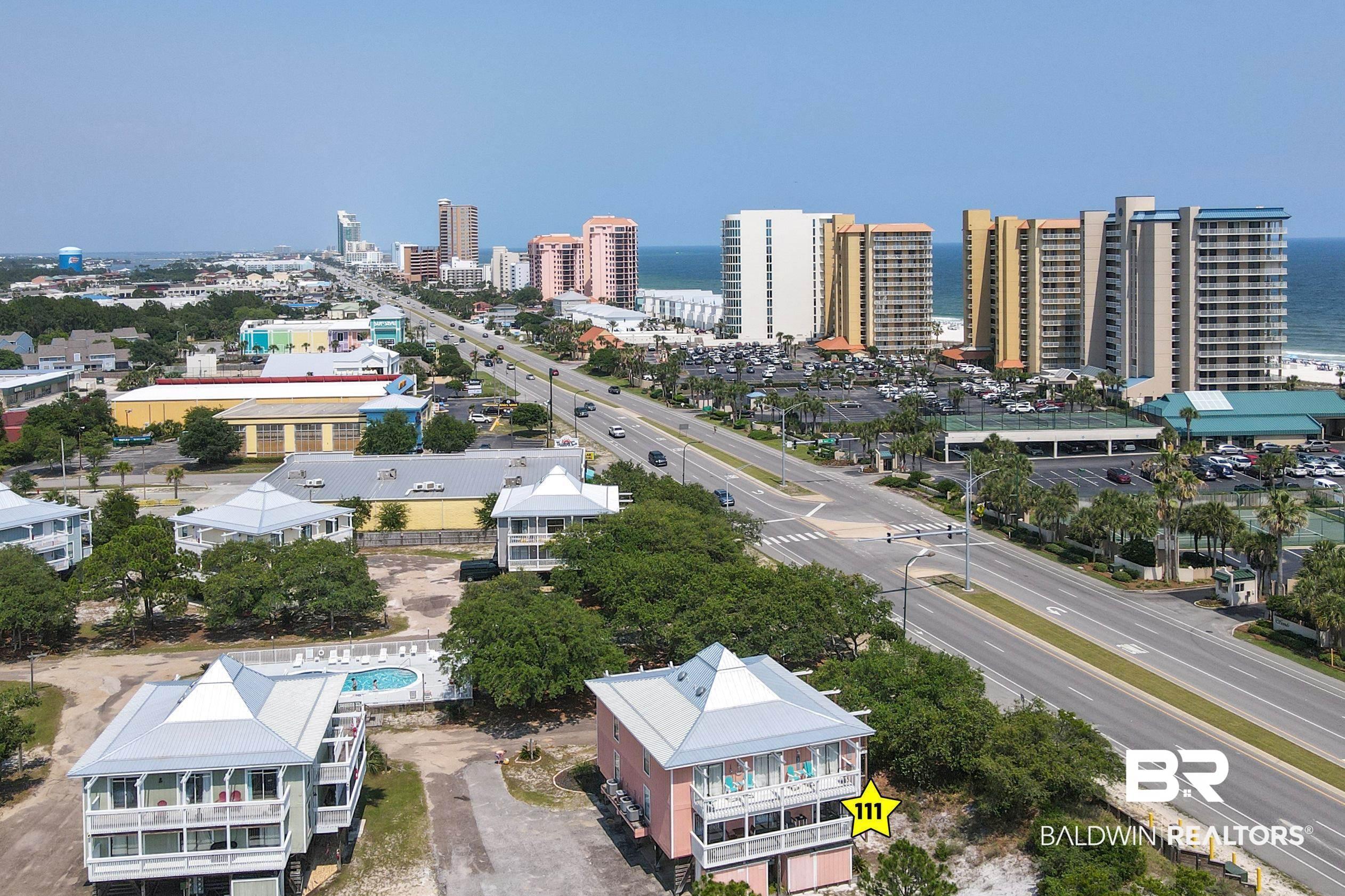 Image 2: View of urban area featuring a large body of water