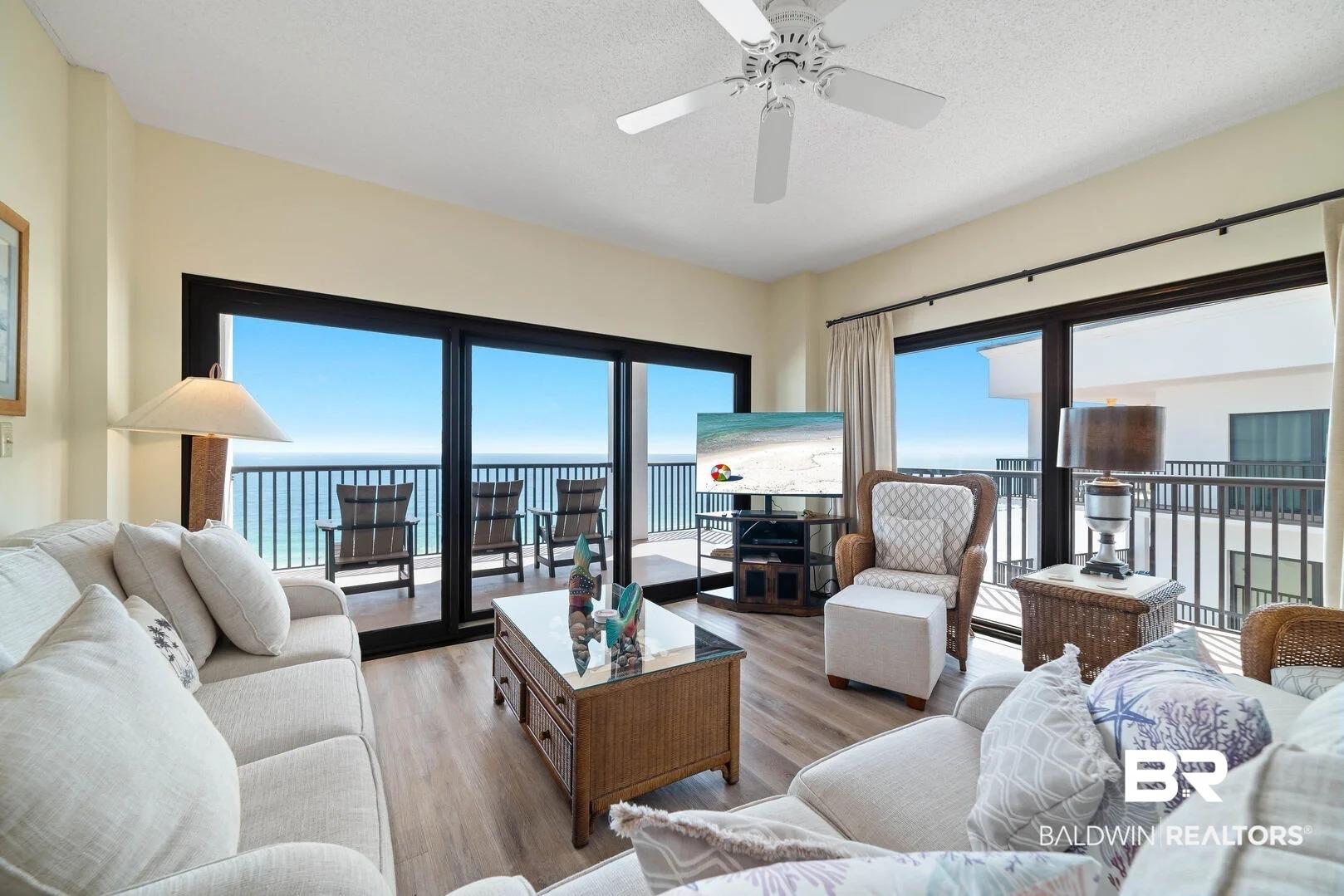 Image 4: Living room featuring wood finished floors, ceiling fan, plenty of natural light, and a textured ceiling