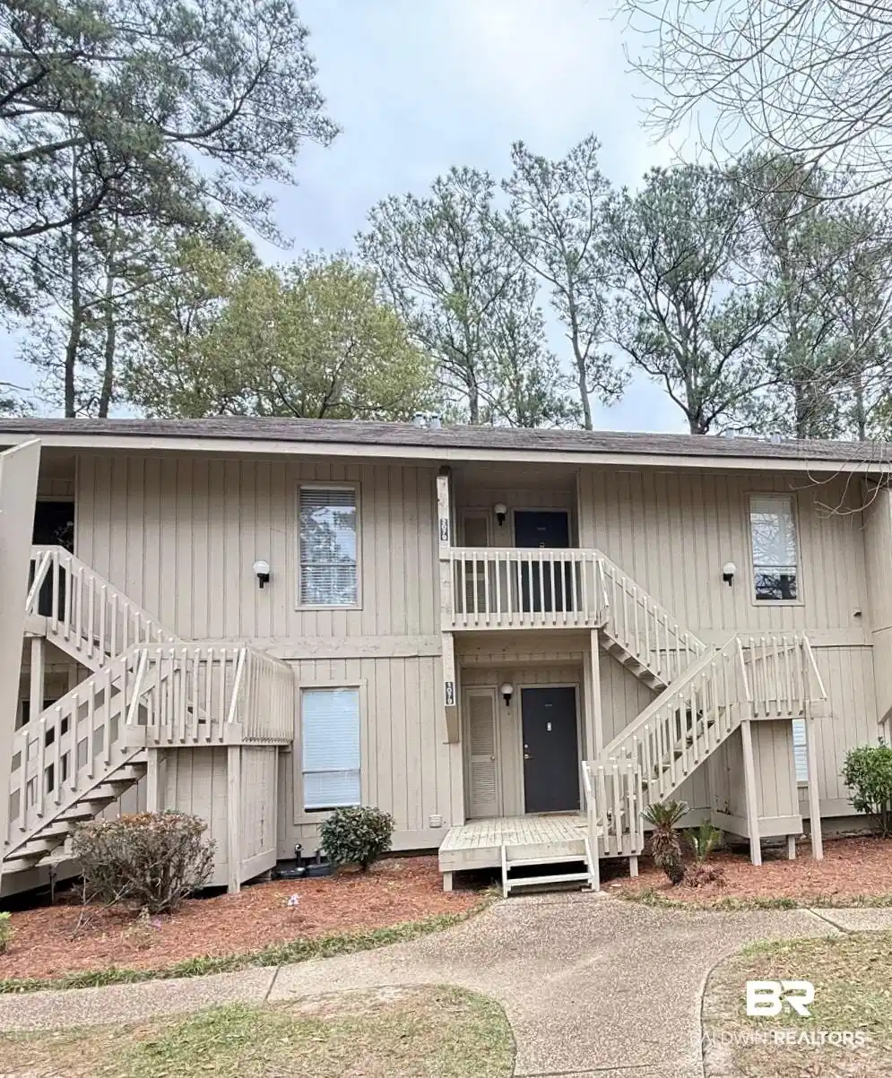 Image 1: View of building exterior featuring stairs