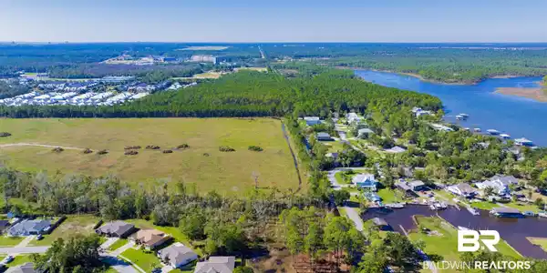 Image 4: Bird's eye view featuring a water view and a wooded view
