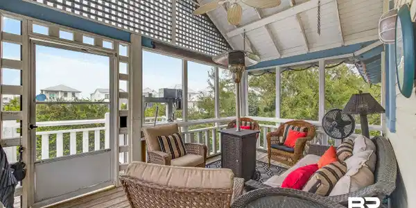 Image 2: Sunroom featuring ceiling fan, an outdoor hangout area, a wooden deck, and beamed ceiling