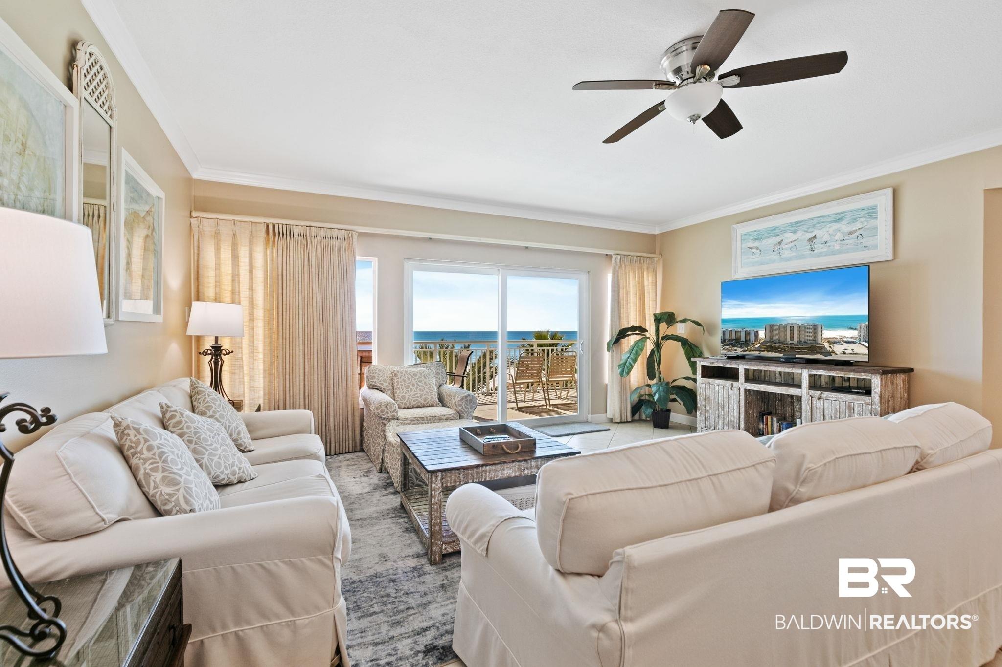 Image 3: Living area featuring a ceiling fan and ornamental molding