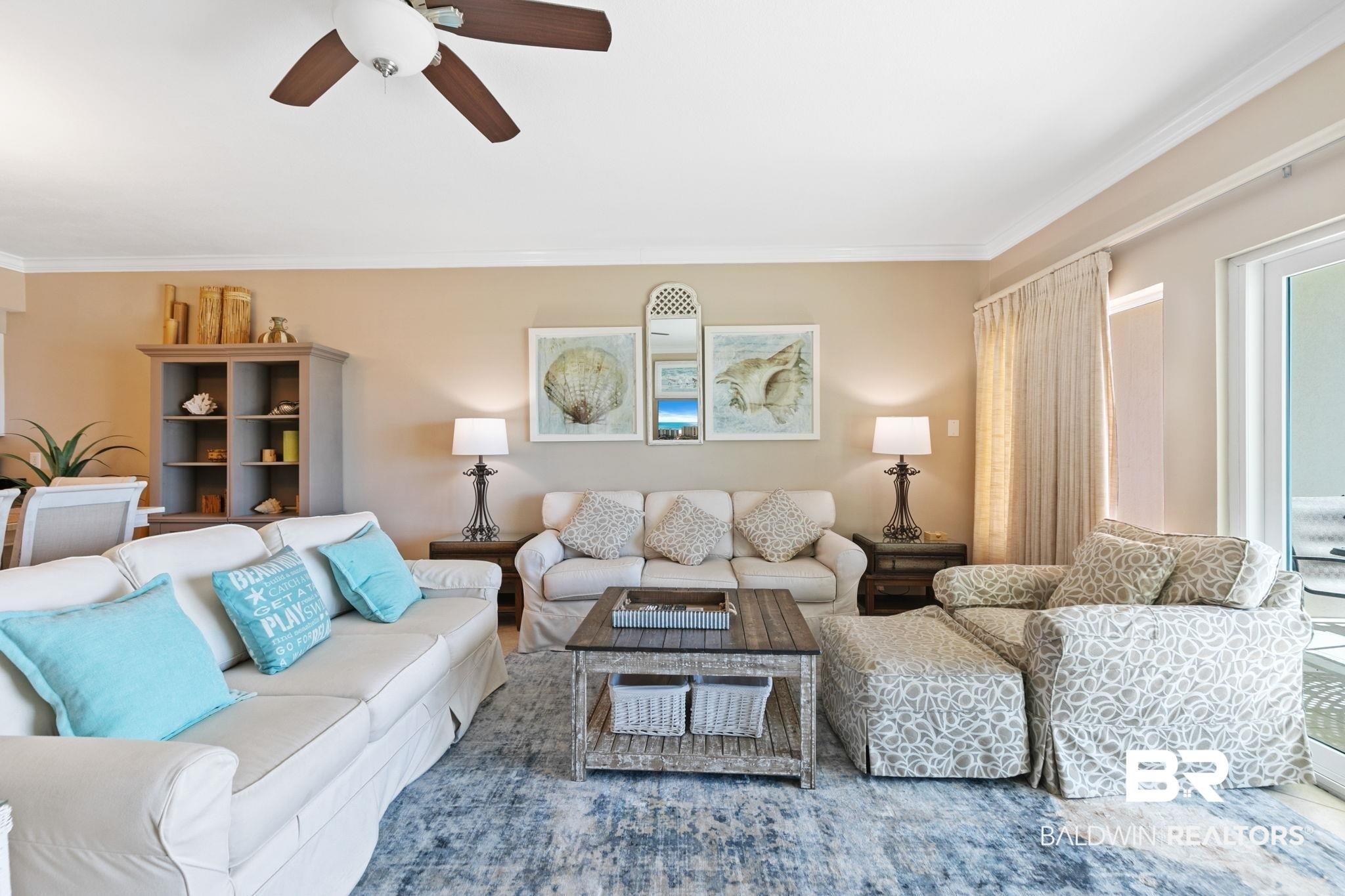 Image 4: Living area featuring ceiling fan and ornamental molding
