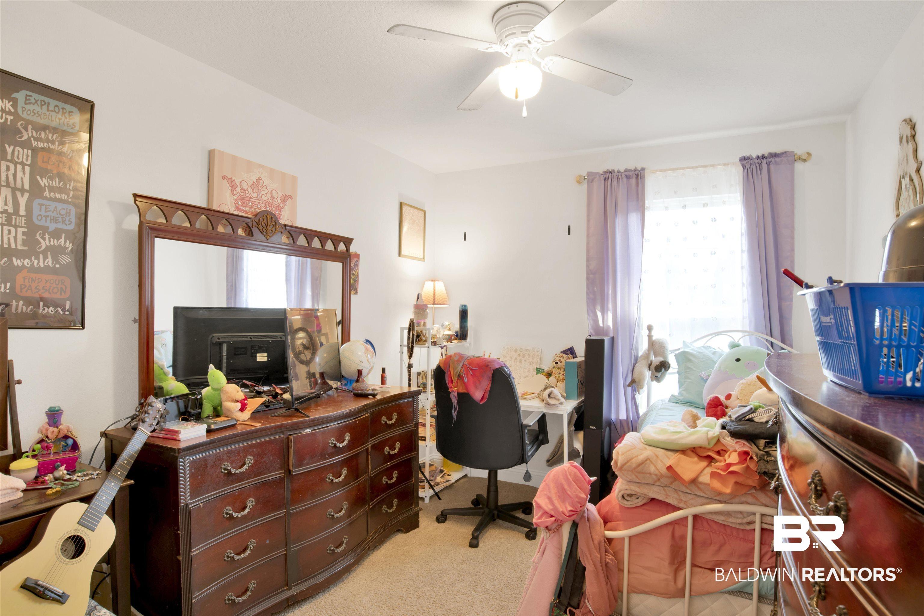 Image 4: Office featuring light carpet and a ceiling fan