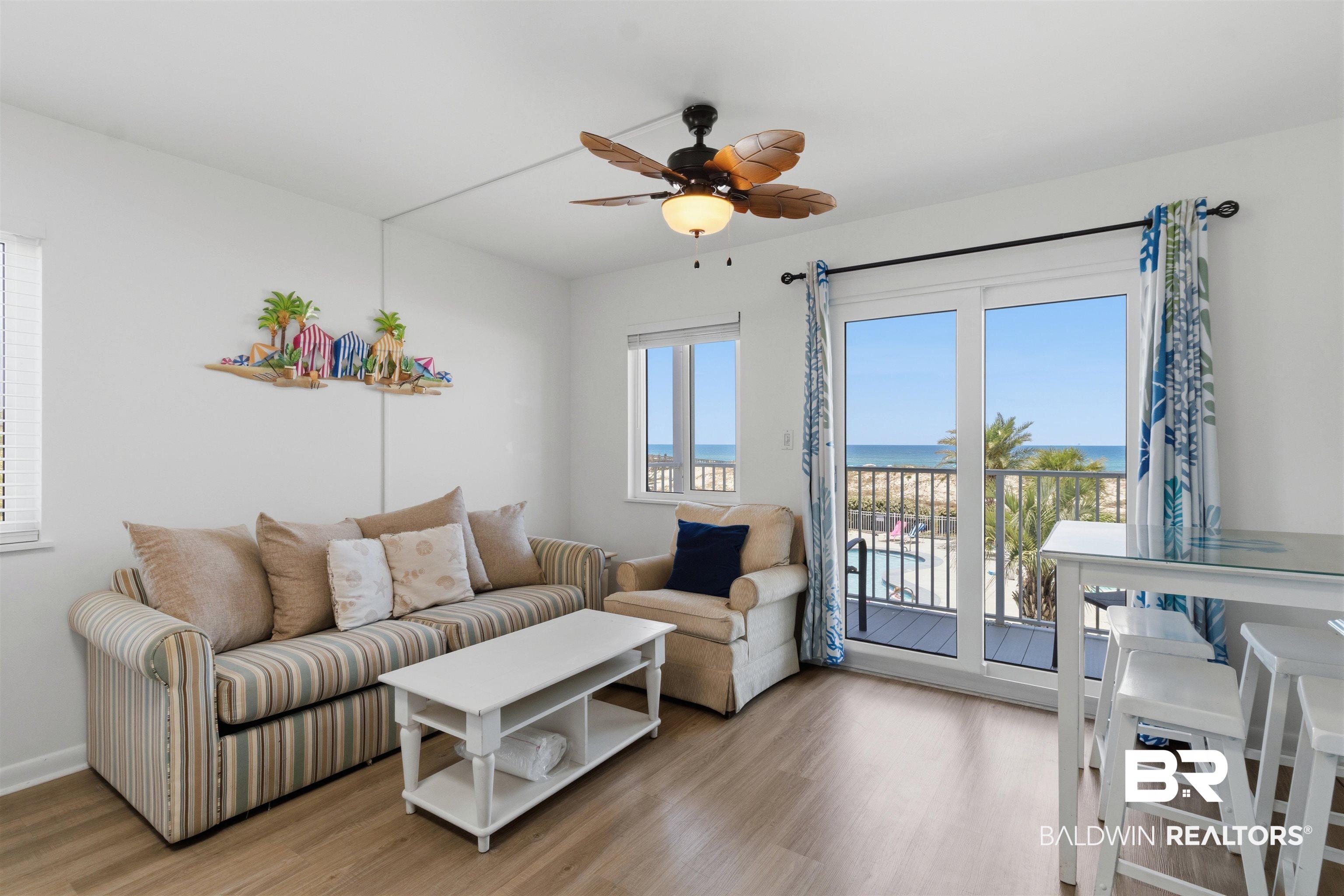Image 4: Unit improvements done in 2021 - updated Vinyl Flooring, Stainless Appliances, Tiled Backsplash, HVAC. Unit has storm rated new sliding door and windows.