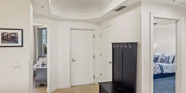Image 3: Foyer featuring neutral tile flooring and crown molding