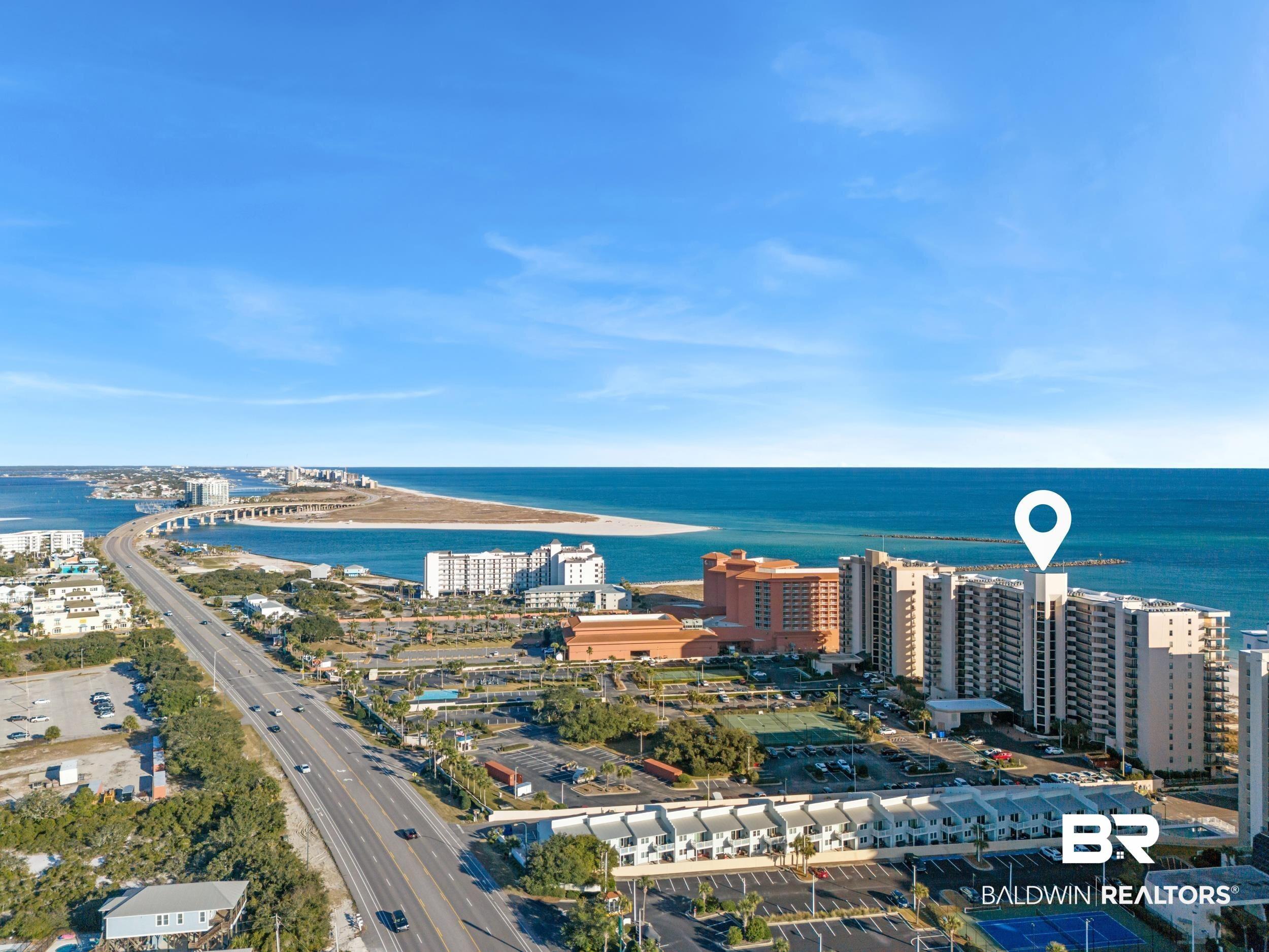 Image 2: View of urban area featuring a large body of water