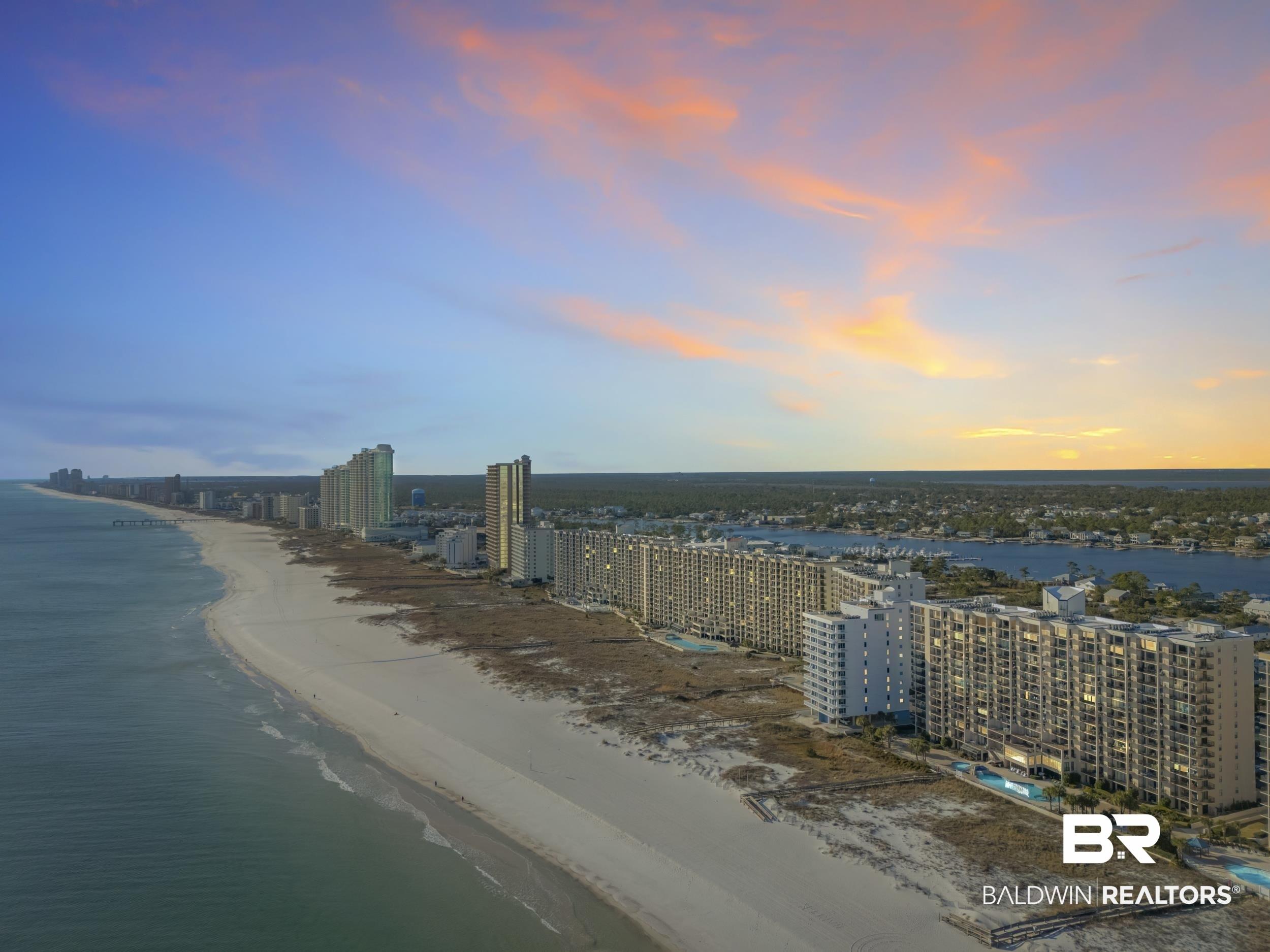 Image 4: Water view with local beach and nearby urban area