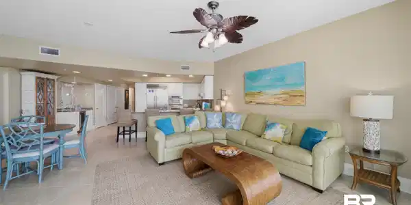 Image 3: Living area featuring ceiling fan and light tile patterned floors