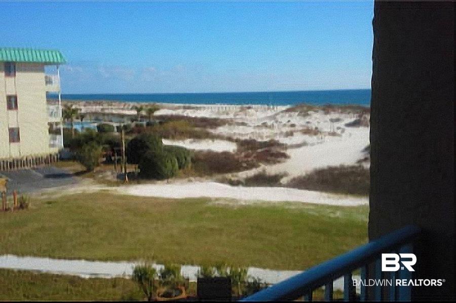 Image 2: Expansive ocean vista with white sand dunes