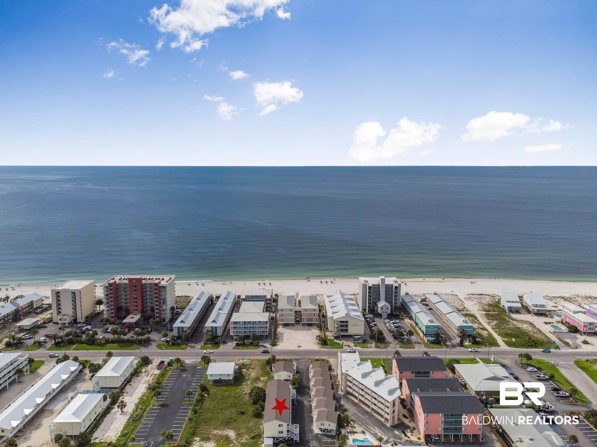 Image 2: Aerial view of expansive beach