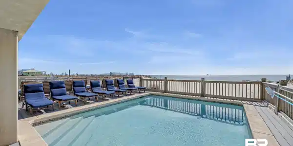 Image 4: View of pool featuring a water view