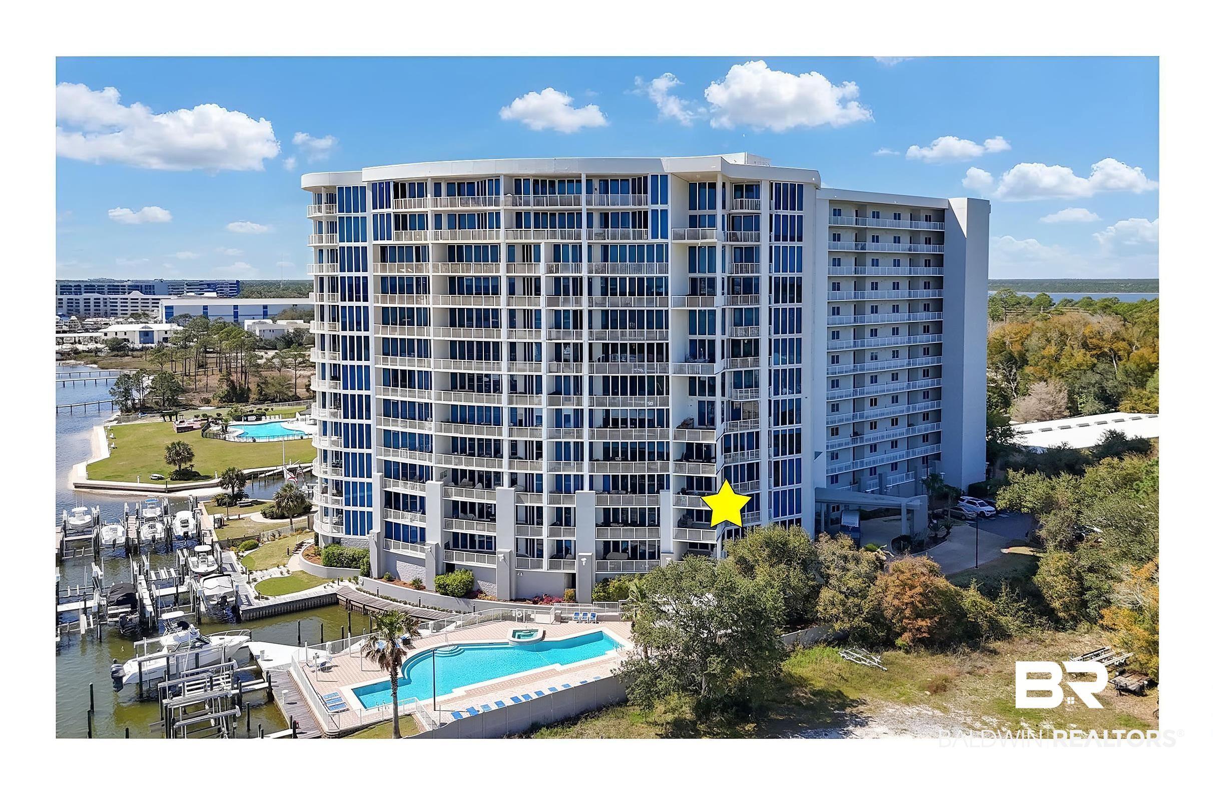 Image 2: View of apartment building / complex featuring a water view