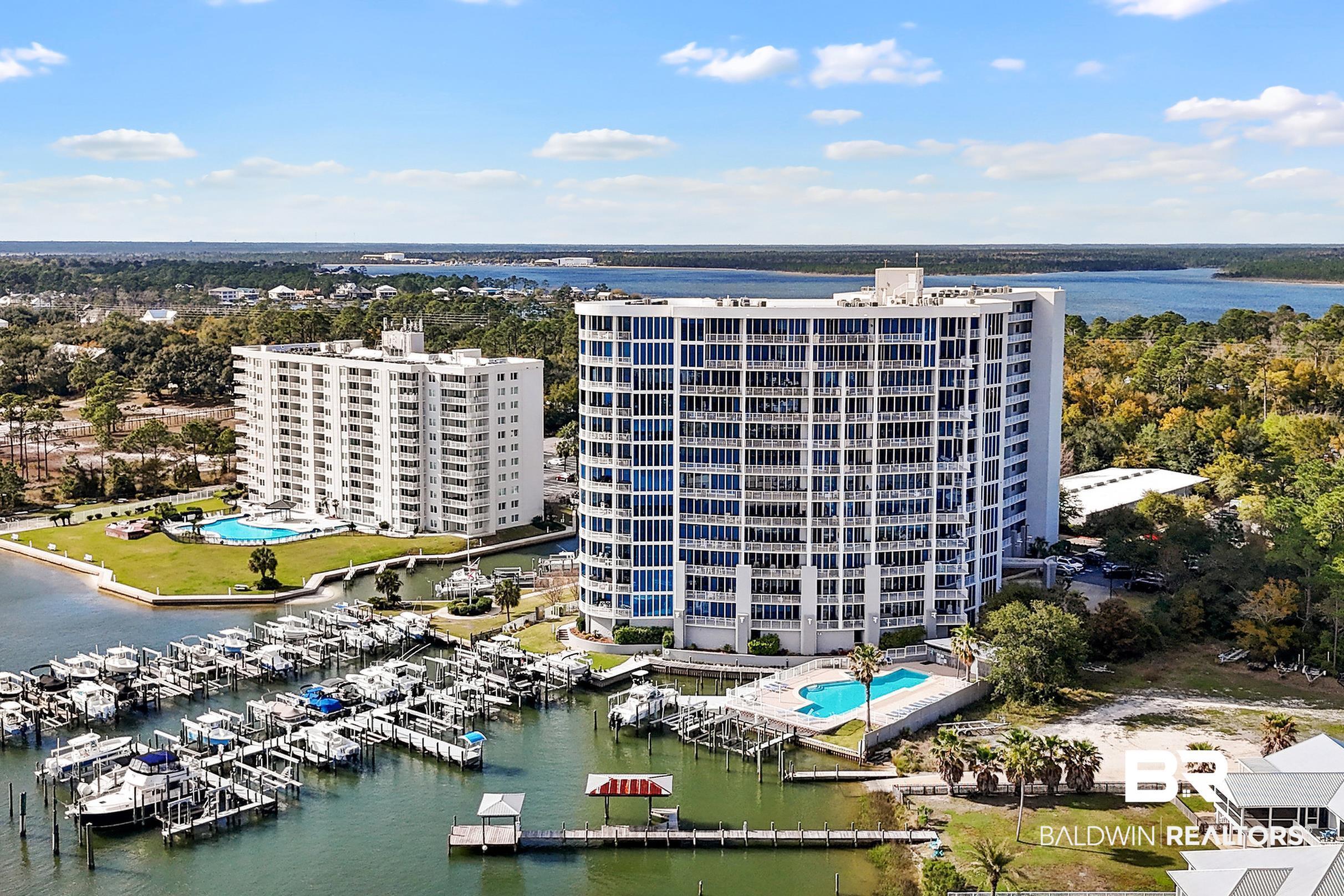 Image 4: Drone / aerial view of a pool and a nearby body of water