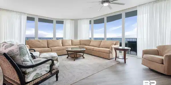 Image 2: Living room featuring plenty of natural light, light hardwood / wood-style flooring, and floor to ceiling windows