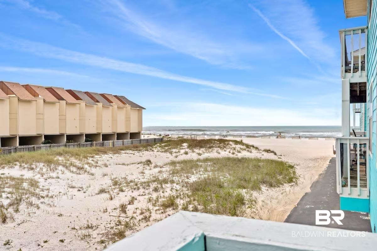 Image 3: View of yard featuring view of water and beach