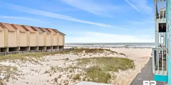 Image 3: View of yard featuring view of water and beach