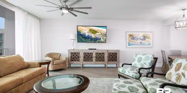 Image 4: Living room with ceiling fan with notable chandelier and light hardwood / wood-style flooring