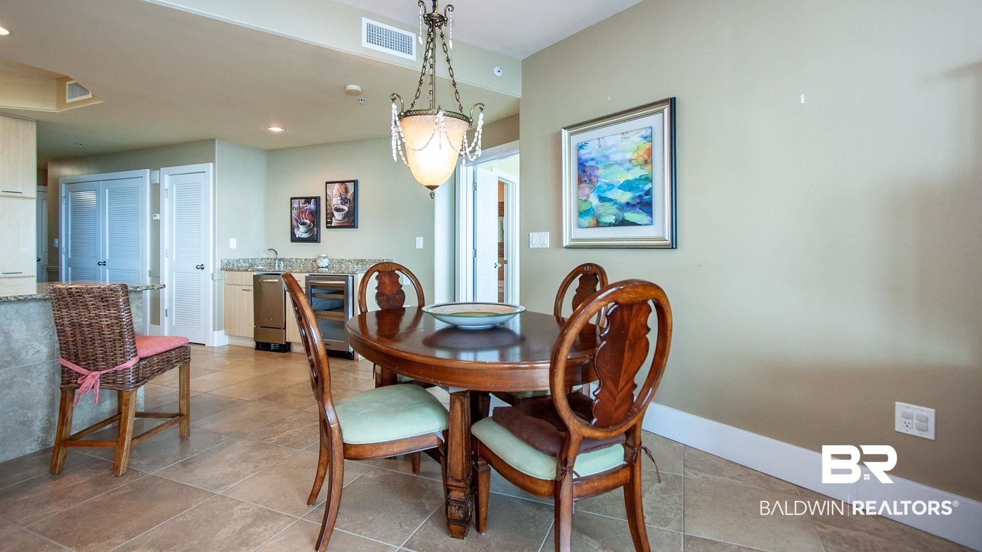 Image 3: Dining room featuring baseboards, light tile patterned floors, and recessed lighting