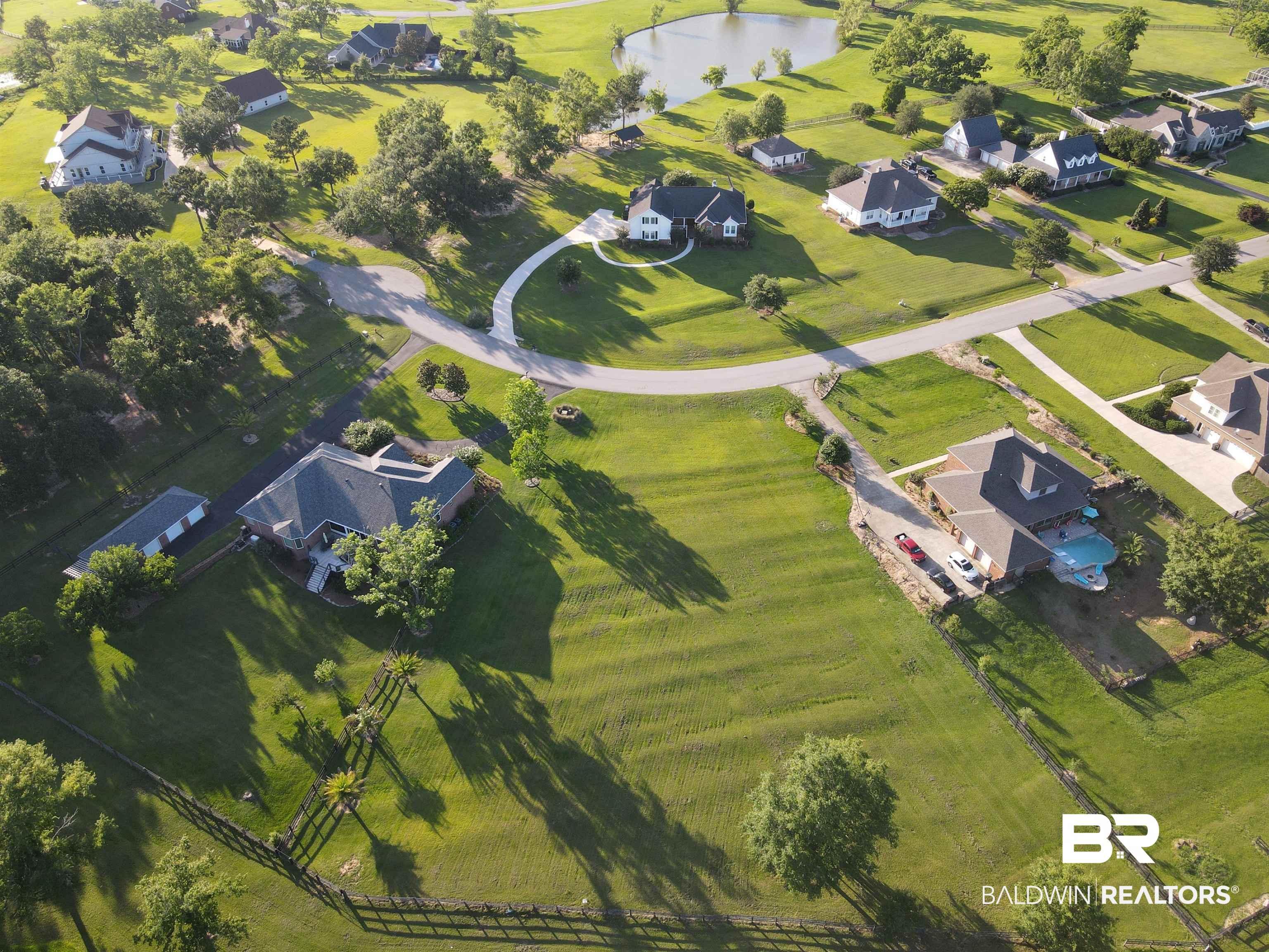 Image 1: Aerial view of property and surrounding area featuring nearby suburban area