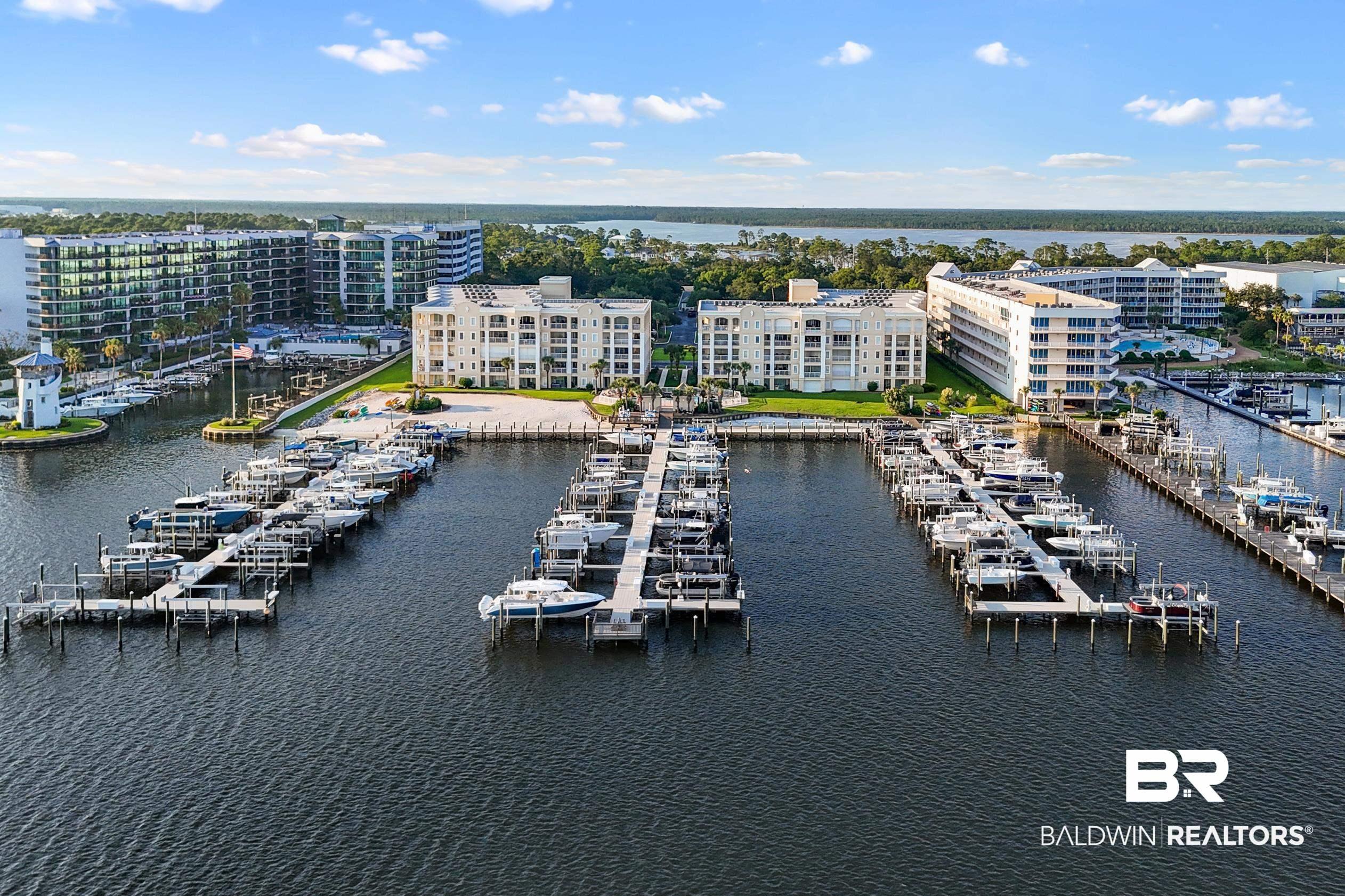 Image 1: Aerial view of a marina and a nearby body of water