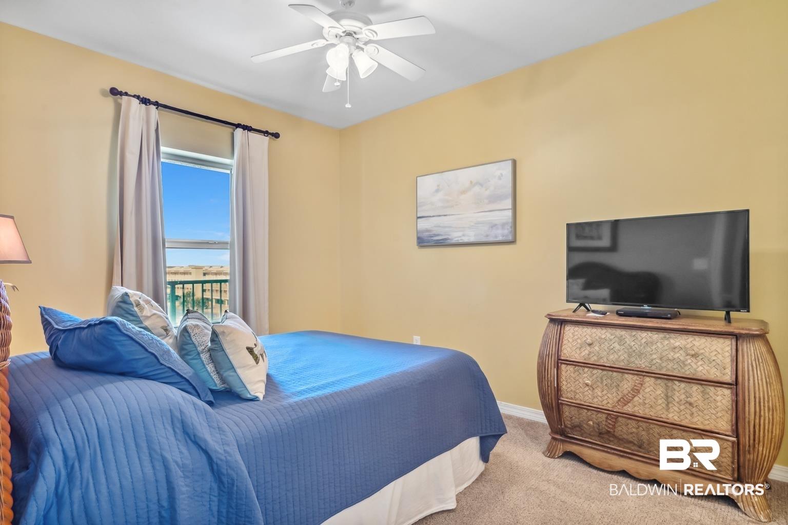 Image 3: Bedroom featuring carpet flooring and a ceiling fan