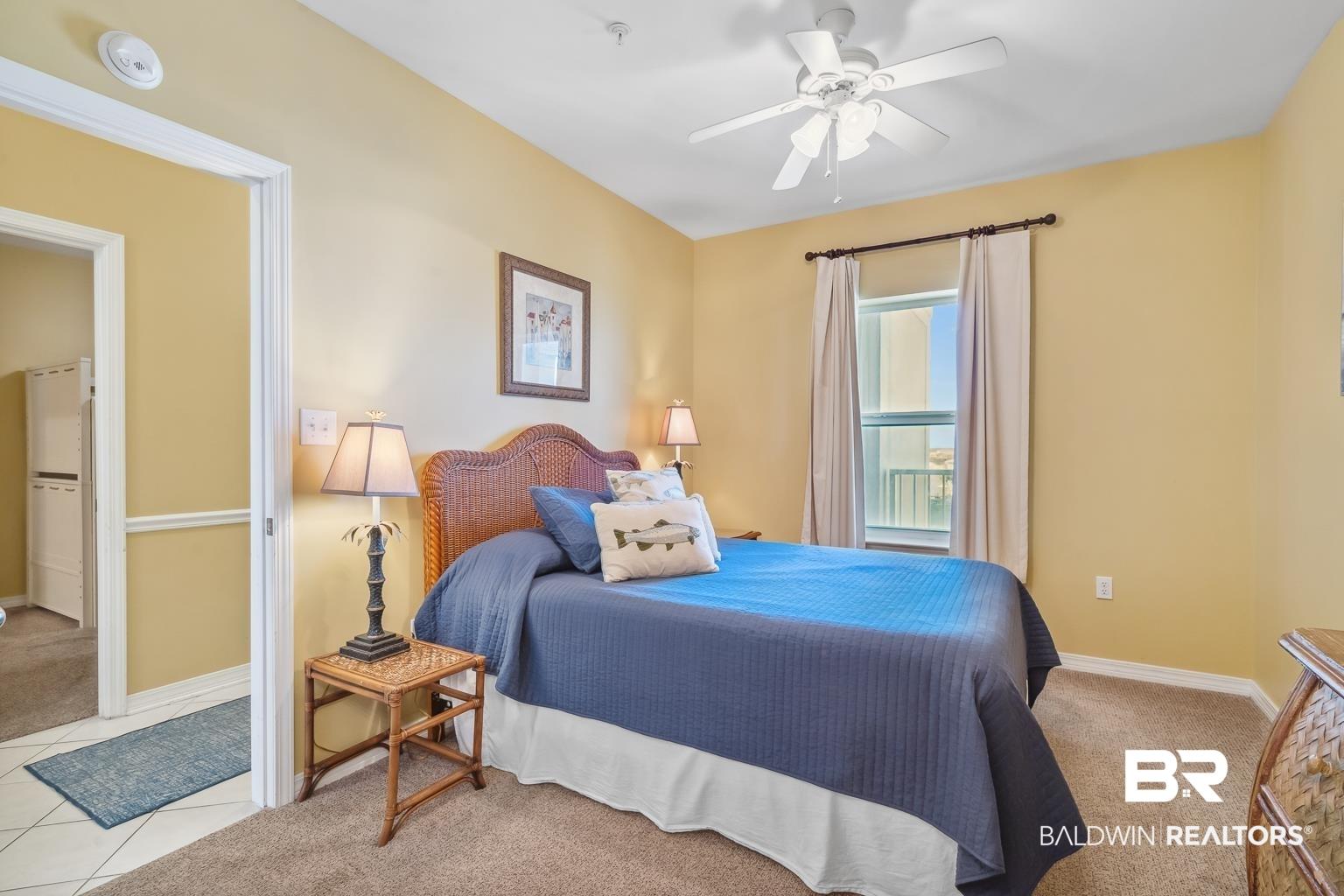 Image 4: Bedroom featuring light colored carpet and a ceiling fan
