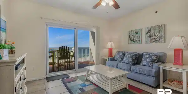 Image 3: Living area with a ceiling fan, a textured ceiling, and light tile patterned floors